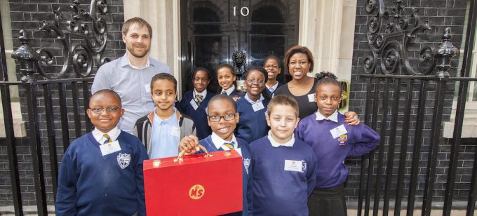 After-school club members with their tutors in front of 10 Downing Street (photo: Tom Oldham)